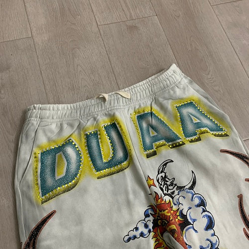 DUAA White Tattoo‑Style Graphic Sweatpants